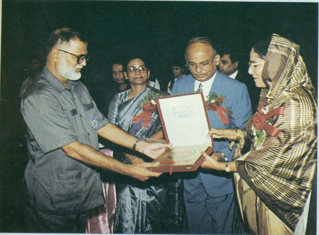 Best College 1996 Principal Prof Kazi Faruky receiving  Award from Prime Minister Sheikh Hasina